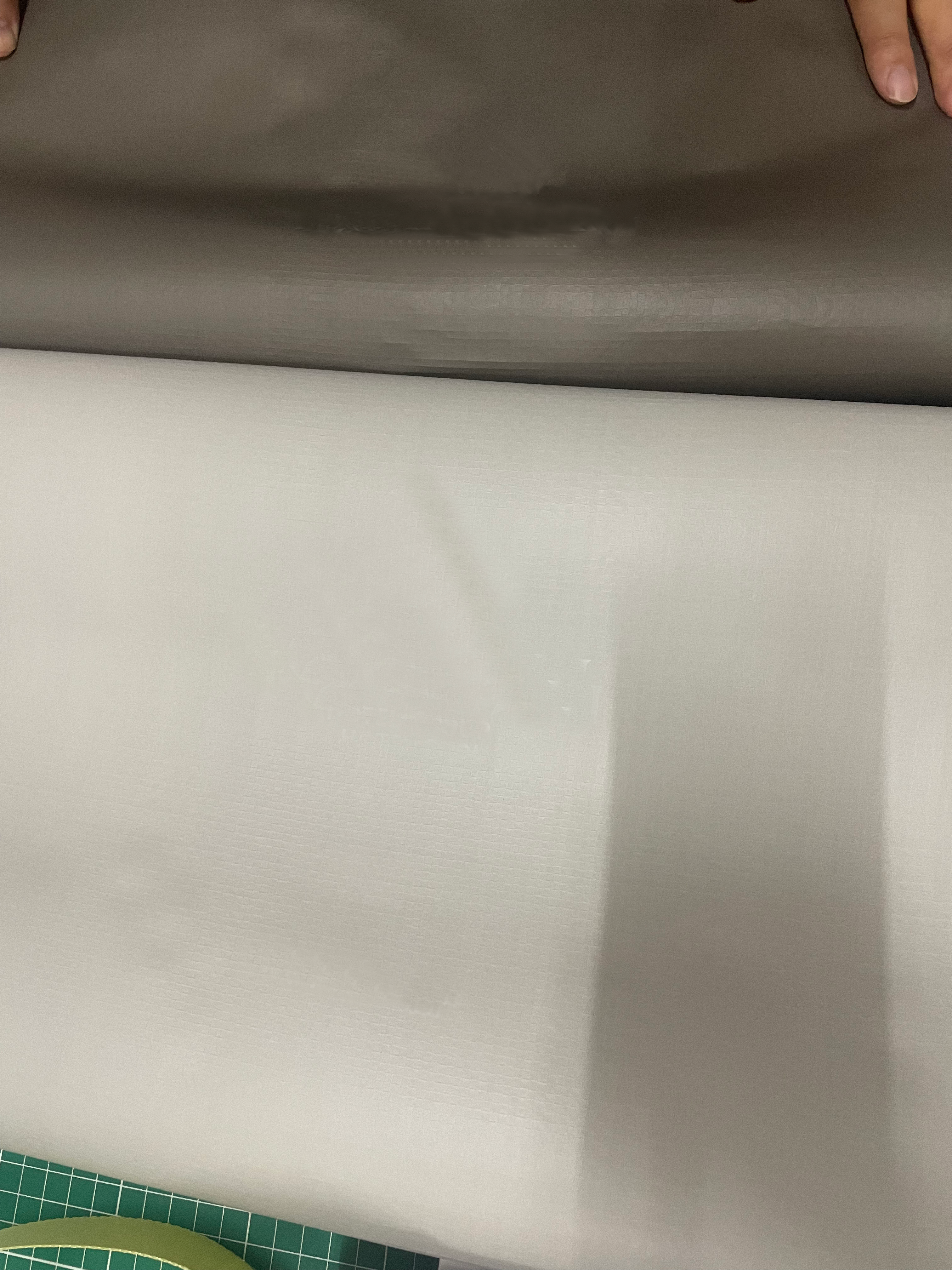 Dark gray and light gray PP woven fabric samples for the hotel bag body.